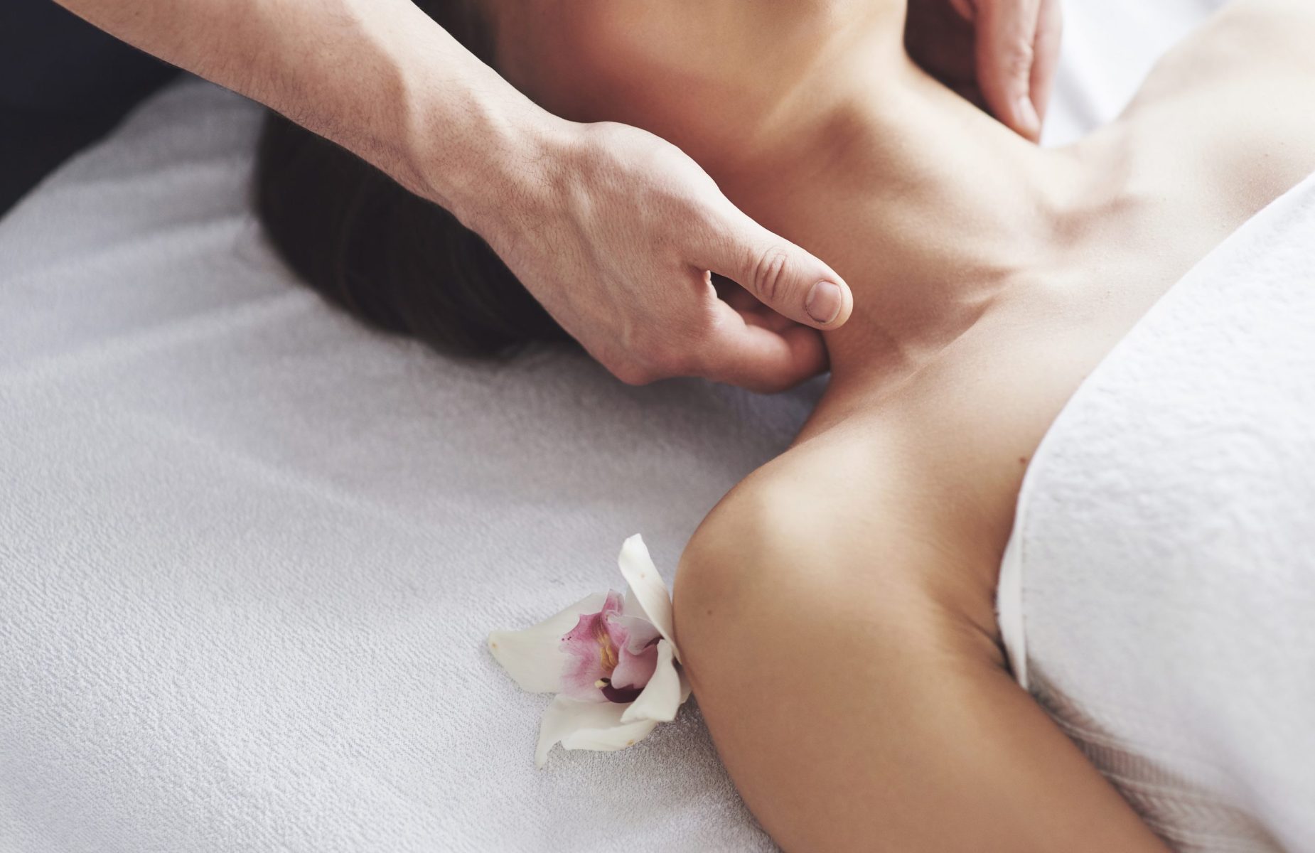 Close-up of a young woman gets a massage at the beauty salon. Procedures for skin and body